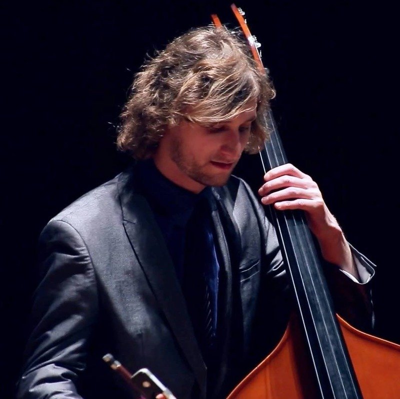 Freddie playing double bass, close up